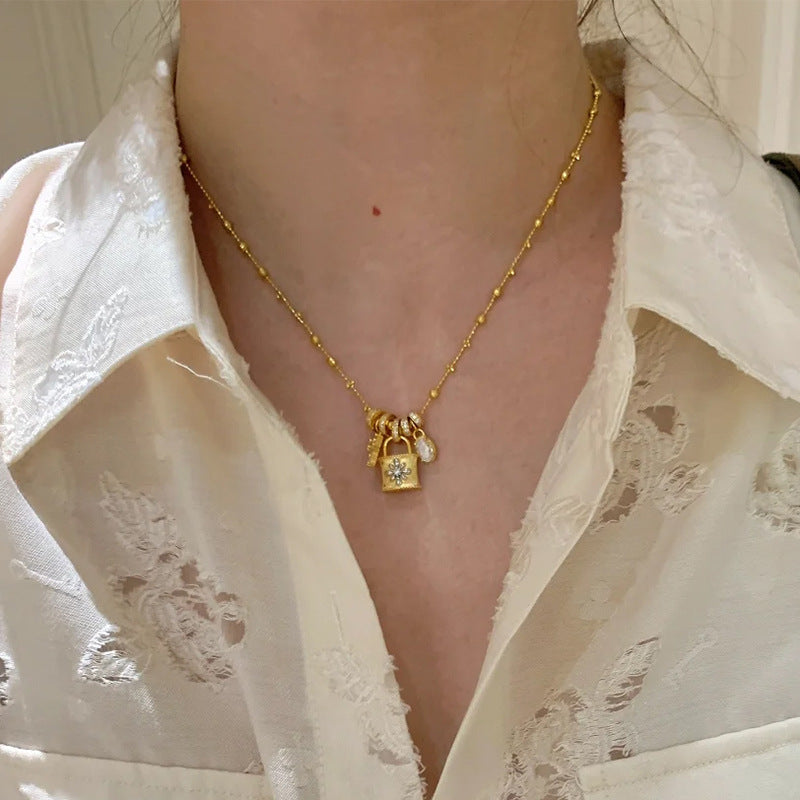 Elegant Cross & Lock Pendant Necklace – Dainty Gold Chain with Crystal Charms