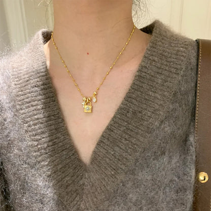 Elegant Cross & Lock Pendant Necklace – Dainty Gold Chain with Crystal Charms