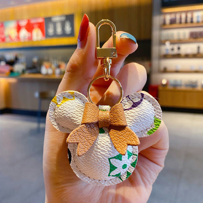 高級ミッキーキーホルダー - フェイクレザー & ハンドバッグや車に使えるファーポンポンチャーム