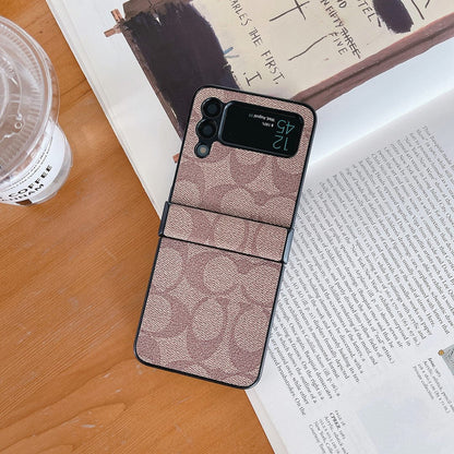 Capa de telefone Samsung Coach Z Flip/Z Fold com alça de dedo