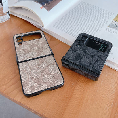 Capa de telefone Samsung Coach Z Flip/Z Fold com alça de dedo