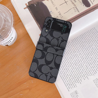 Capa de telefone Samsung Coach Z Flip/Z Fold com alça de dedo
