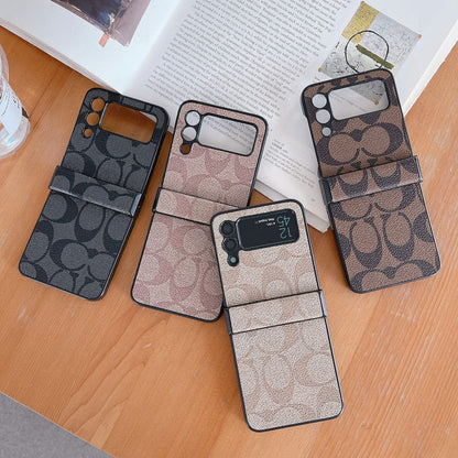 Capa de telefone Samsung Coach Z Flip/Z Fold com alça de dedo