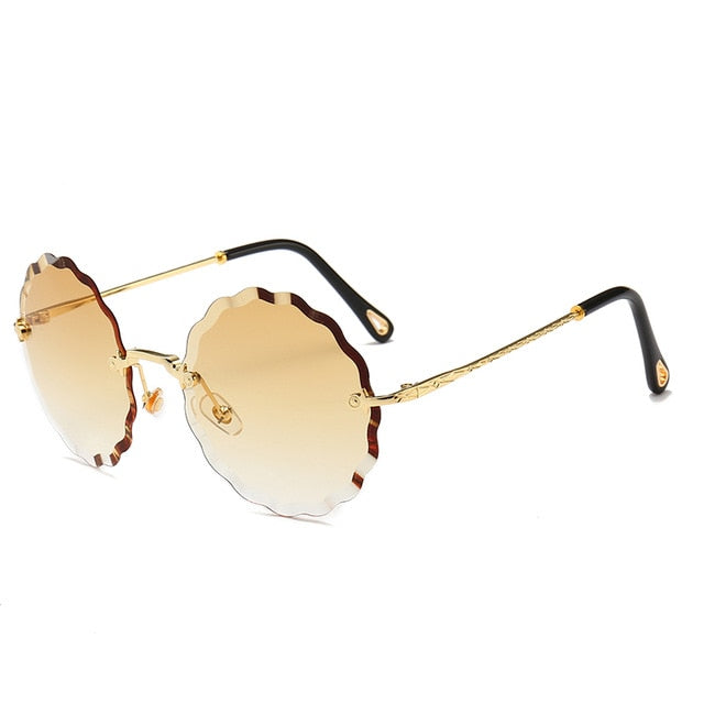 Ylelliset pyöreät aurinkolasit naisten merkkisuunnittelijat reunattomat aurinkolasit naisten värisävyyn muodikkaille Rosie-laseille